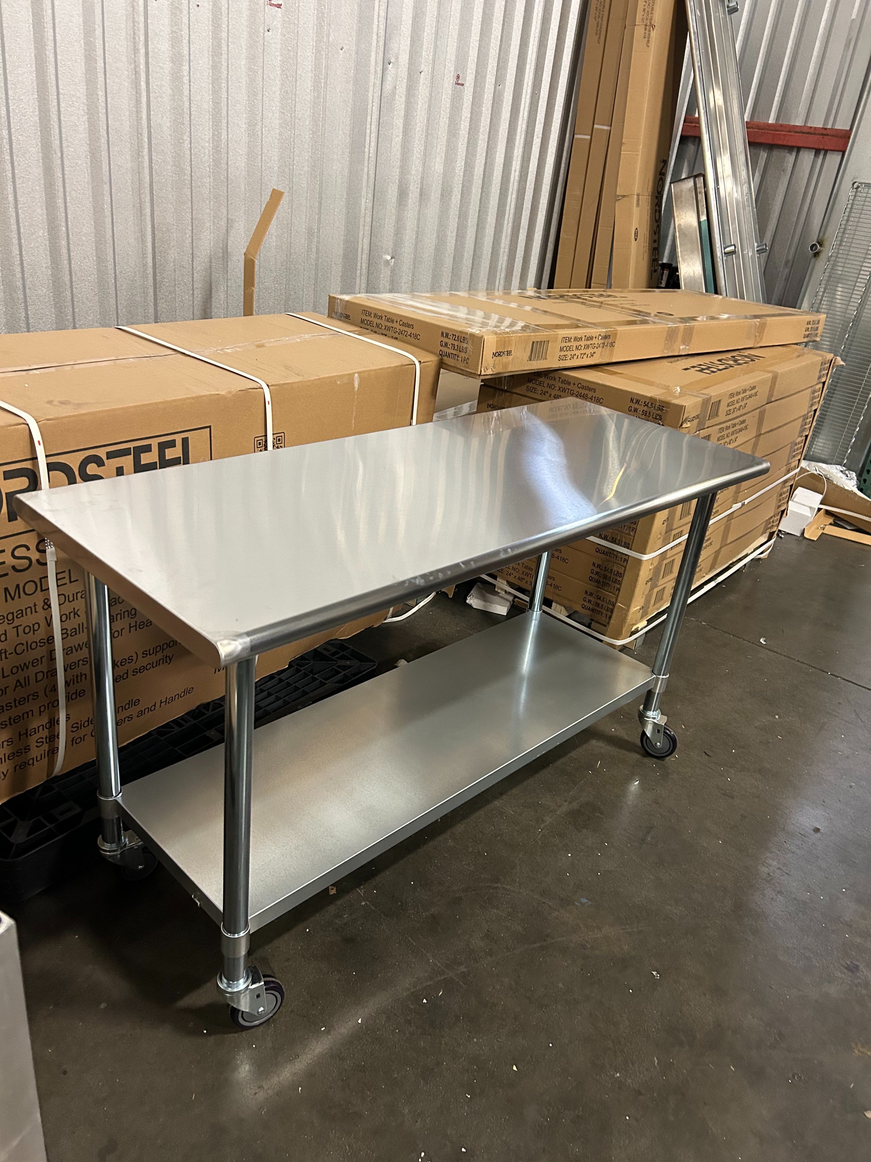 New rolling stainless steel work tables NSF Nordsteel brand 4 feet x 24" 