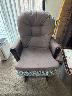 Black glider with 2 cushions