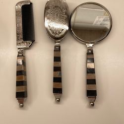 The image displays a Vintage Godinger Silver Co. Noah's Ark Design 3 Pc. Vanity Set, consisting of a comb, brush, and hand mirror.  This set features 