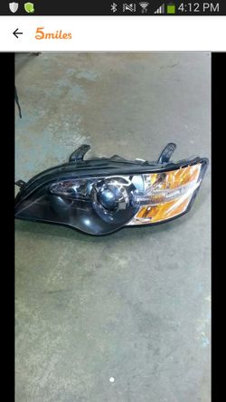 2005 subaru legacy left side headlight