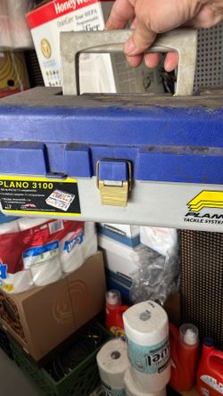 Fishing Box With Fishing Stuff On It