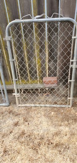 Two galvanized Cyclone gates for sale they are 32x46