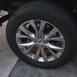 Ford F-150 factory rims for sale, complete with tires; the tires are like new.