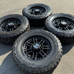 F250 F350 20” Hostile Black Wheels With 35” Toyo R/T tires