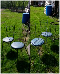 4 Wrought iron chairs. 2 blue and 2 black. Need fresh paint. And one needs new wood piece for the seat.