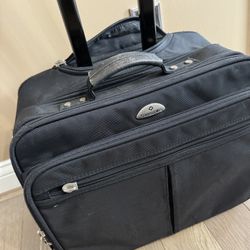 Samsonite Rolling Laptop Bag in good shape! Tons of storage and handle can also stow away in bag.