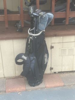 Set of callaway golf clubs (2 lady cobra clubs) with Samuel Adam’s bag