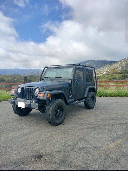 Jeep Wrangler TJ With Roof Rack Tires