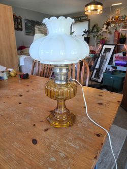 Vintage amber lamp with milk glass topper