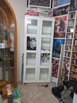 Wood curio storage cabinet