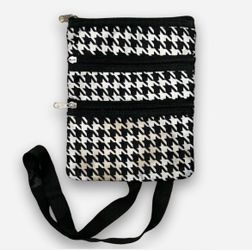 Black & white houndstooth crossbody bag with adjustable strap and multiple pockets