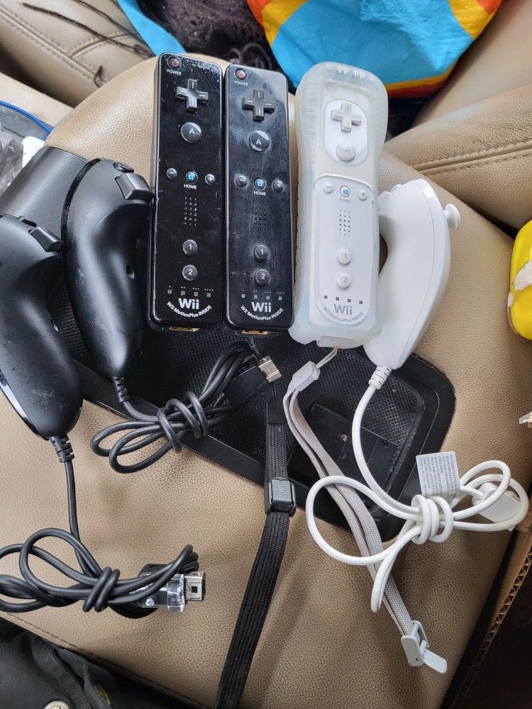 3 Nintendo Brand Wii Motion Plus Controllers And 3 Wii Nunchucks
