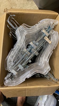 box full of clear plastic hangers