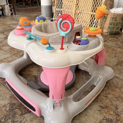 Storkcraft Baby Activity Walker With Jumping Board, Feeding Tray,  Swivel Seat, Toys And Music 