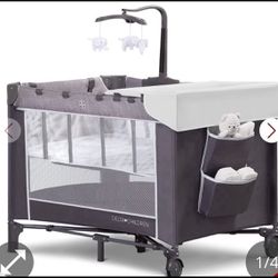 Delta Children LX Deluxe Portable Baby Play Yard With Removable Bassinet And Changing Table, Eclipsen  Open box item box is damaged   INVENTORY NUMBER