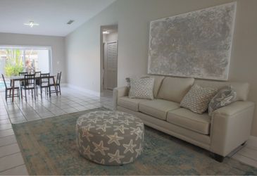 Couch like new from rooms to go beige