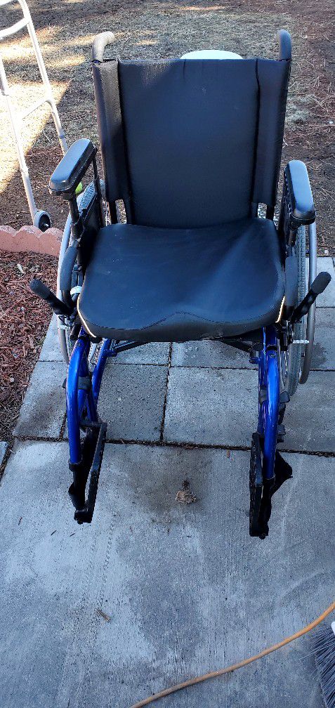 Quickie  Deluxe Wheel Chair