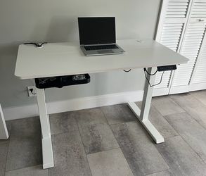 Electric adjustable height white desk