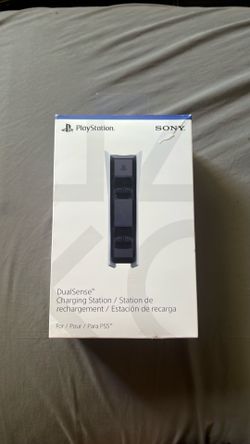 A white and black dual sense charging station ps5