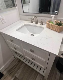 36 in - used vanity with granite top - 2 drawers