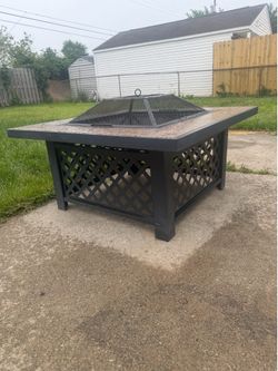 Fire pit with stone top.
