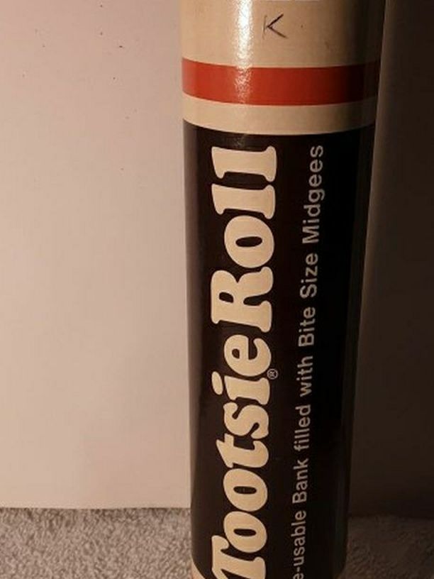 A Pair Of Tootsie Roll Toy Banks