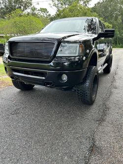 Ford F-150 Lifted Black Pickup Truck
