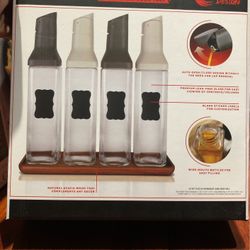 Four piece auto pour sauce dispensers with acacia wood tray new in box