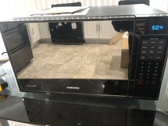 Black Samsung mirrored counter top Grill microwave