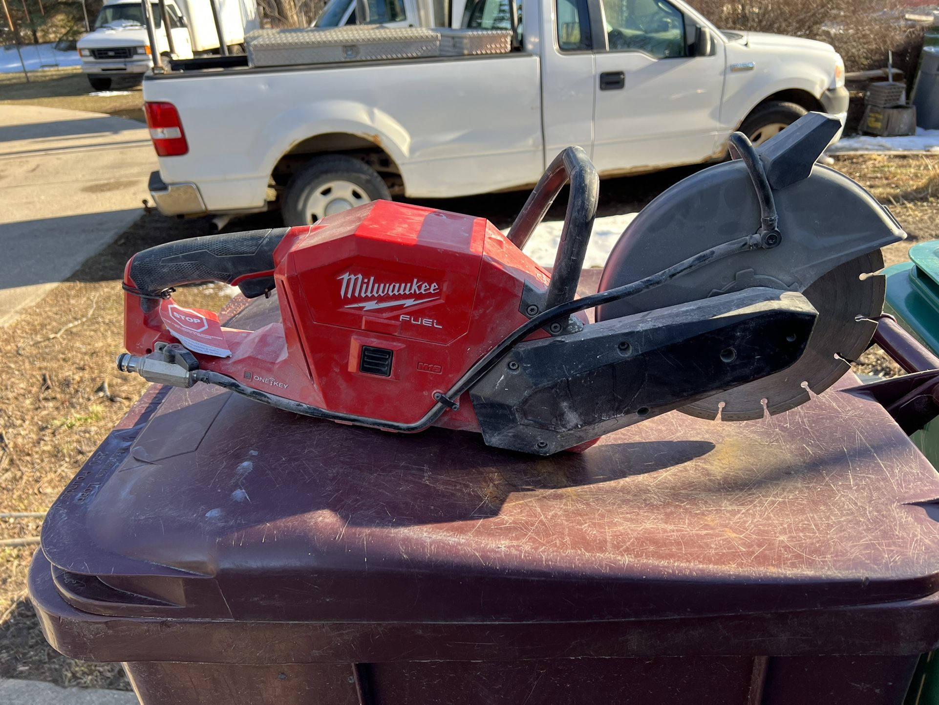 Milwaukee Fuel 9”cutoff Saw Comes With Concrete Blade And Metal Cut Off Blade Also Has Water Hookup Adapter For When You Cut Cement Inside
