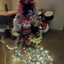3 foot Christmas tree with extra lights you can wrap around it or do whatever you want with them