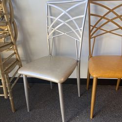 New Modern Accent Stacking Chairs – Gold & Silver, Commercial Quality  Two high-quality commercial-grade metal stacking chairs available. One gold and