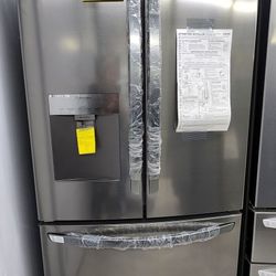 LG NEW REFRIGERATOR, MOUNTED FREEZER WITH AN ICEMAKER.