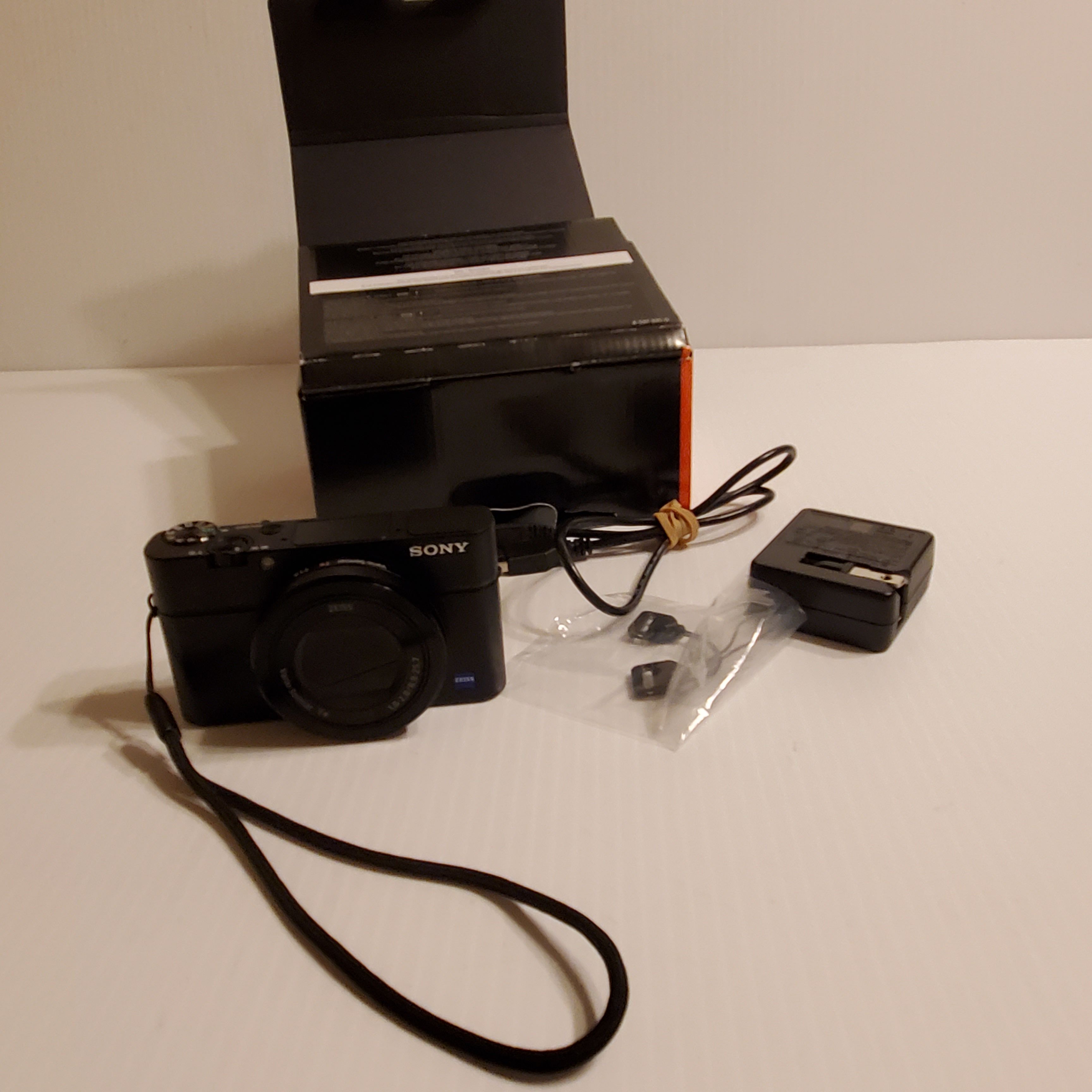 Sony DSC-RX100M3 Digital Camera with accessories - charger and battery. Comes with original box.