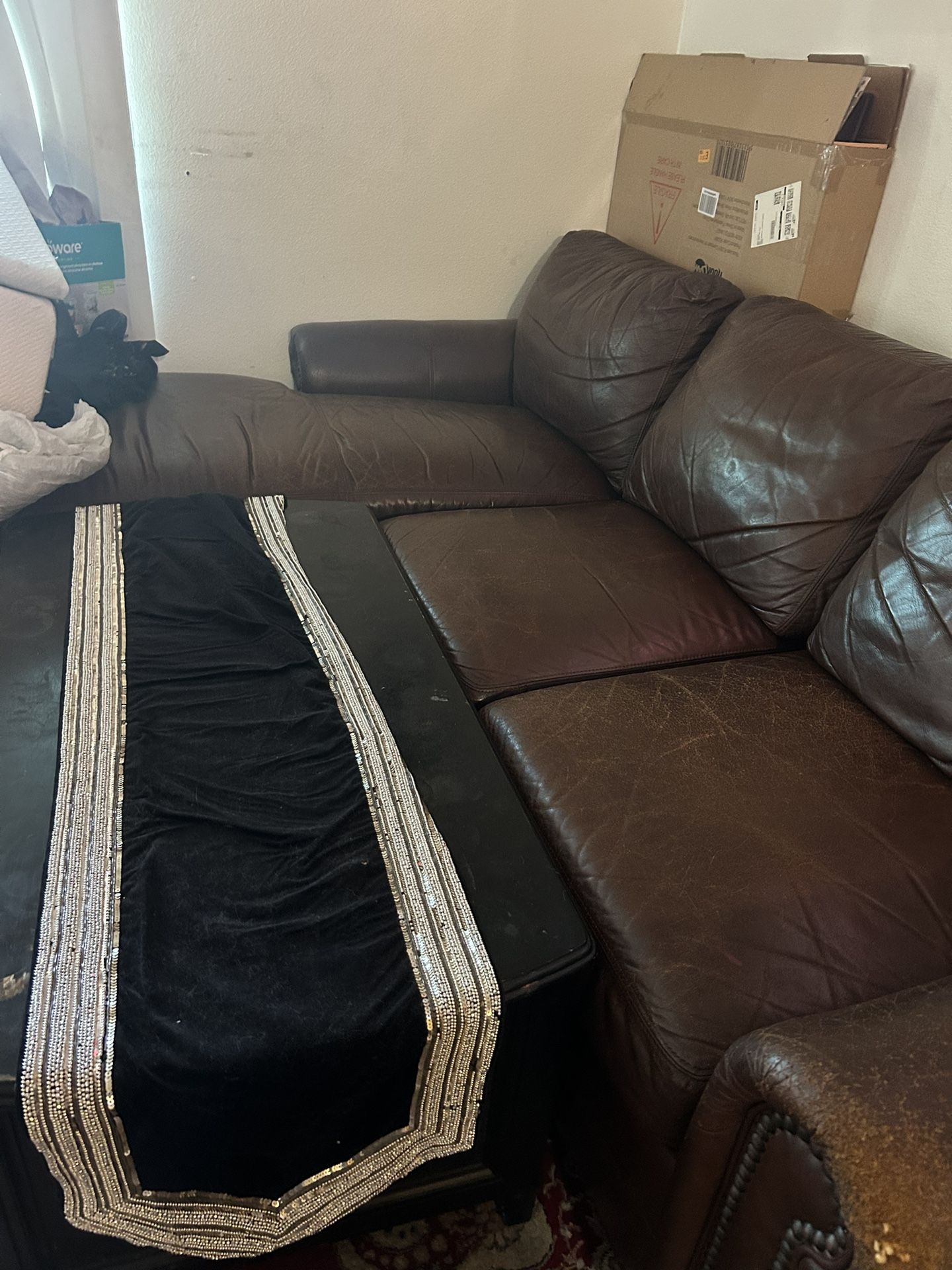 L couch and black table