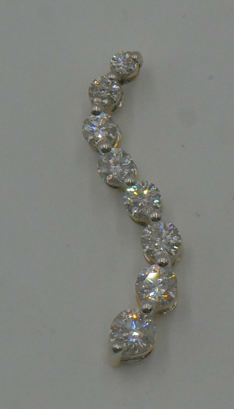 14kt yellow gold pendant “journey “ with round and baguette diamonds (3 carat approximately) super Mint. 8 round diamonds - 0.40;0.33;0.27; 0:23; 0.19