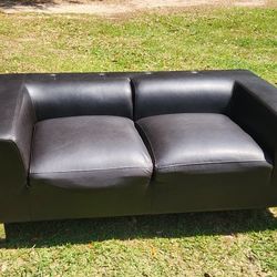 Black modern style leather couch very comfy cushions attached