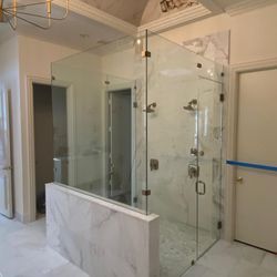 FRAMELESS SHOWER ENCLOSURE 