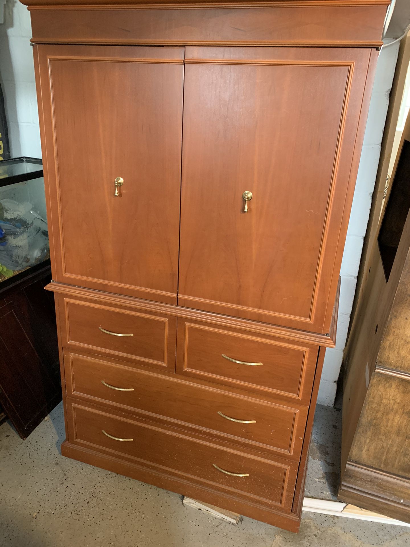 Armoire. Three row of drawers and top opens for tv or other storage. 62” tall x 44” wide x 26” deep