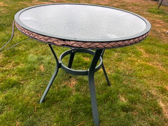 Small metal and glass top patio table* pending *