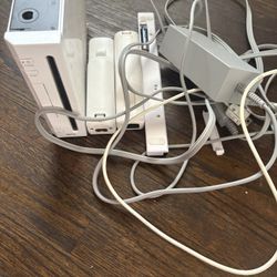 Wii console with two controllers