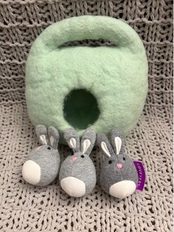 Lovevery bunnies in a felt barrow baby toy