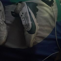 Football cleats green and white nike