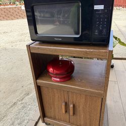 Beautiful antique kitchen cabinet and Microwave.