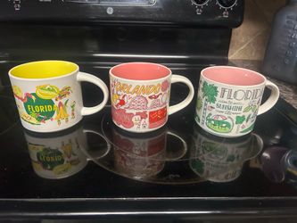 Starbucks coffee mugs at of three