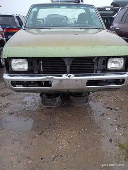 1995 Nissan Hardbody Pickup  D21 2.4 liter/manual/ door panels mirrors many parts