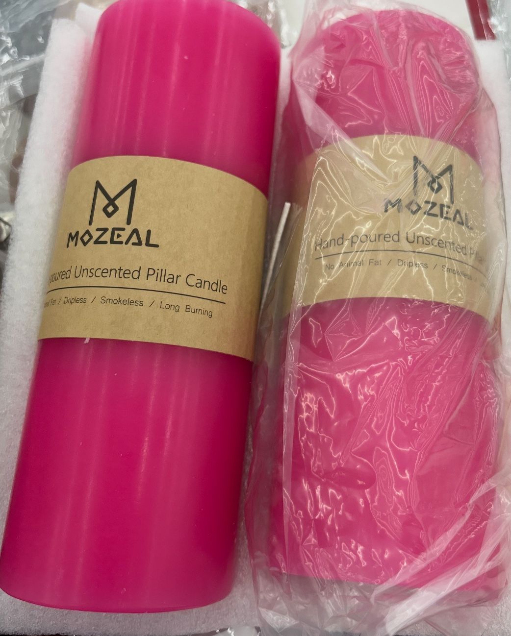 New in box pair of Mozeal Hand Poured Candles 3in x 8in hot pink color