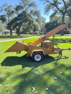 Tow Behind drum style wood chipper powered by Ford industrial diesel engine