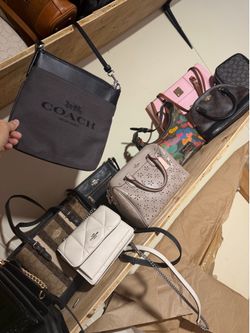 Lots of purses wallets wristlets!! Great prices!!