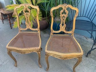A pair of 19th-century French-style gilt wood side chairs with caned seats. Origin Paris France